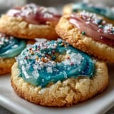 Bright, tender lemon cookies topped with delicate pastel glaze, ideal for Easter or garden parties.