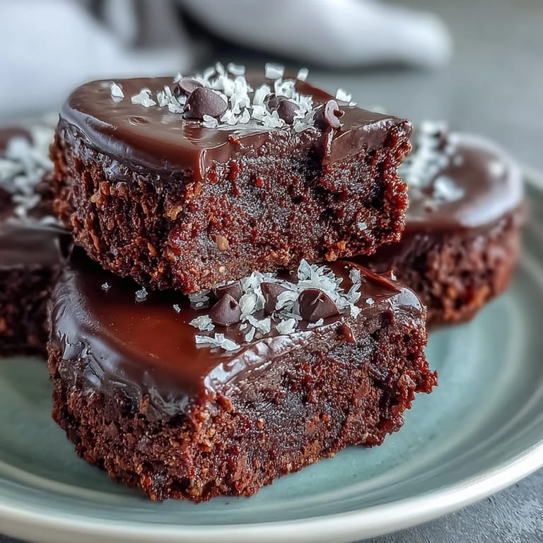 Close-up of irresistible, moist Fiber-Maxxing Bean Brownie Bites, showcasing chocolate chips within.